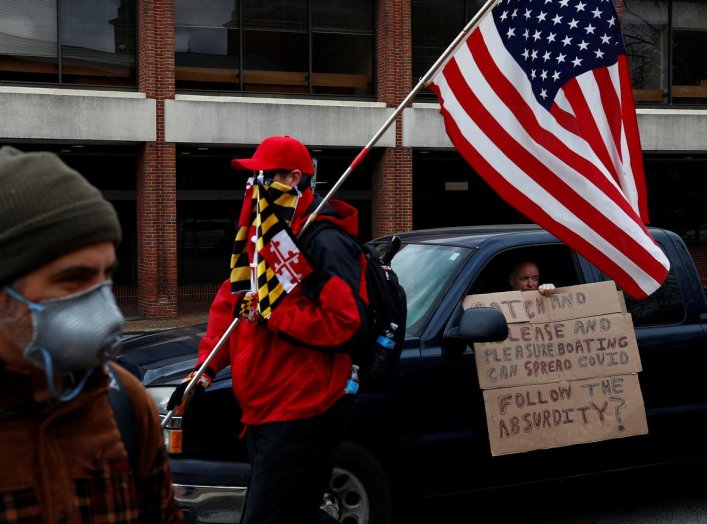 Protestors drive and honk their car horns outside of the State House during a demonstration calling for the re-opening of the state of Maryland amidst the coronavirus disease (COVID-19) outbreak, in Annapolis, Maryland, U.S., April 18, 2020. REUTERS/Tom B