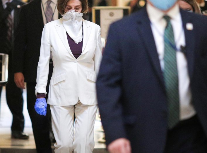 U.S. Speaker of the House Nancy Pelosi (D-CA) wears a face mask as she walks to the House Chamber ahead of a vote on an additional economic stimulus package passed earlier in the week by the U.S. Senate, on Capitol Hill in Washington, U.S., April 23, 2020