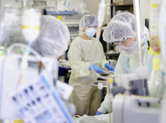 Medical workers treat a coronavirus disease (COVID-19) patient in the ICU of St. Marianna Medical University Hospital in Kawasaki, Japan April 23, 2020, in this photo taken by Kyodo. Picture taken April 23, 2020. Mandatory credit Kyodo/via REUTERS