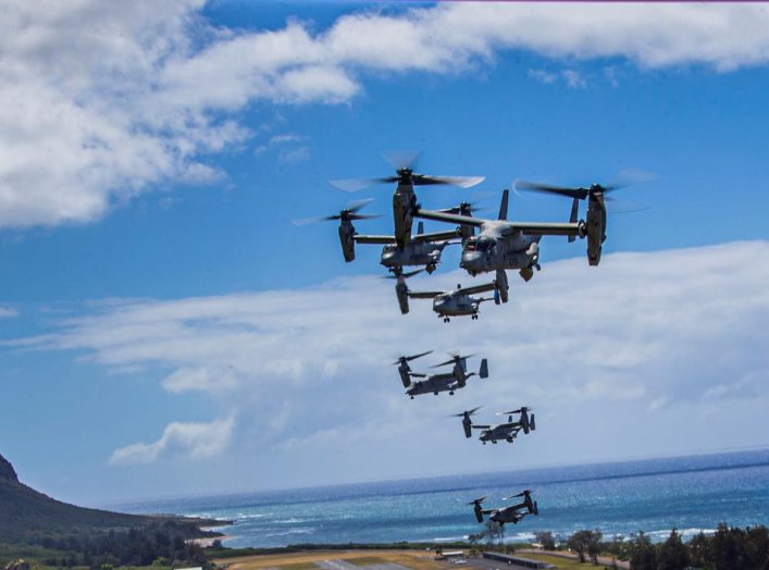 A flight of U.S. Marines MV-22B Osprey transport aircraft fly in formation during an integrated training mission at Marine Corps Air Station Kaneohe Bay near Kailua, Hawaii, U.S. May 19, 2020. Picture taken May 19, 2020. U.S. Marine Corps/Lance Cpl. Jacob