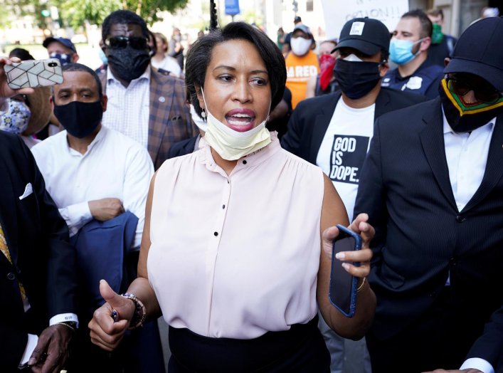 Washington, DC Mayor Muriel Bowser is surrounded by clergy as she speaks during a vigil as protests continue on the streets near the White House over the death in police custody of George Floyd, in Washington, U.S., June 3, 2020. REUTERS/Kevin Lamarque