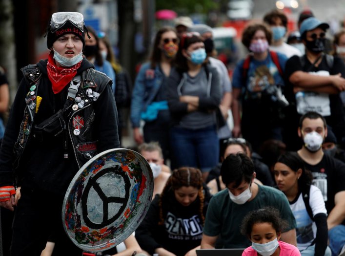 A man holds an improvised shield during a protest against racial inequality and call for defunding of Seattle police, in Seattle, Washington, U.S. June 10, 2020. REUTERS/Goran Tomasevic