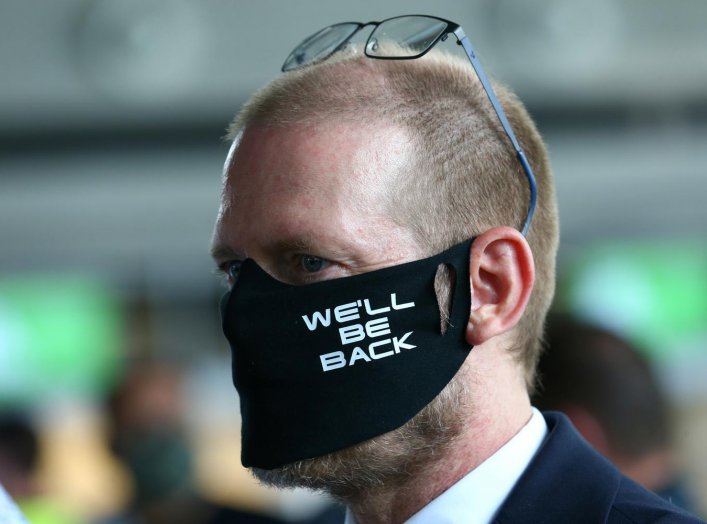 Lufthansa employee wearing face a mask takes part in a protest against the reduction of the number of jobs due to the outbreak of the coronavirus disease (COVID-19), at the airport in Frankfurt, Germany, June 19, 2020. REUTERS/Ralph Orlowski