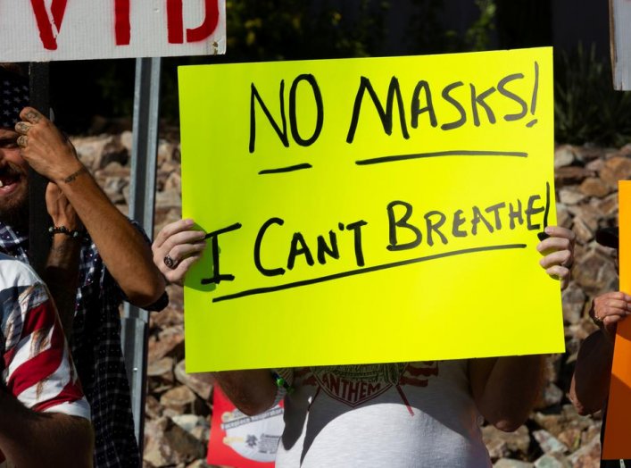 Protestors demonstrate outside the home of Tucson's Mayor Regina Romero in opposition to the new mask mandate to prevent the spread of the coronavirus disease (COVID-19) in Tucson, Arizona, U.S., June 20, 2020. REUTERS/Cheney Orr