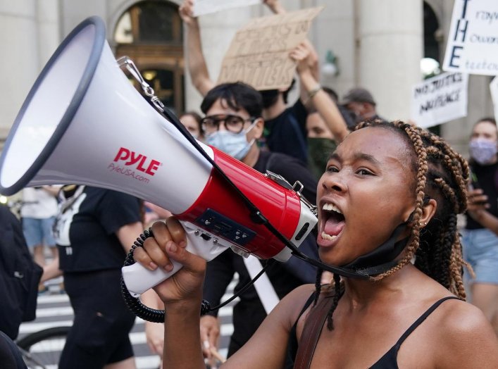 People protest in the street outside a protest to defund the police in a place they are calling the "City Hall Autonomous Zone" in support of "Black Lives Matter" in the Manhattan borough of New York City, New York, U.S., June 30, 2020. REUTERS/Carlo Alle