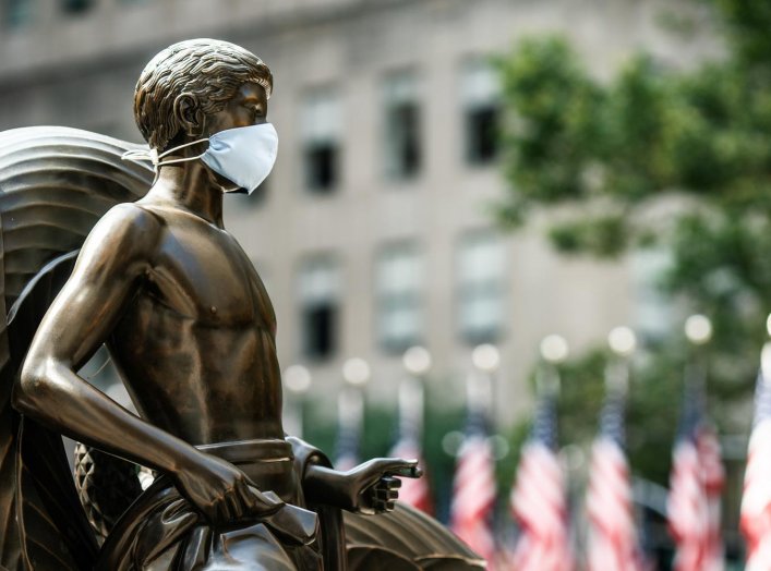 The Mankind Figure of Youth statue at Rockefeller Center in Manhattan is seen adorned with a face mask following the outbreak of the coronavirus disease (COVID-19), in New York City, New York, U.S., July 5, 2020. REUTERS/Jeenah Moon