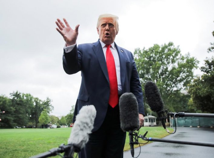 U.S. President Donald Trump speaks to reporters as he departs for a trip to Florida from the South Lawn of the White House in Washington, U.S., July 31, 2020. REUTERS/Carlos Barria