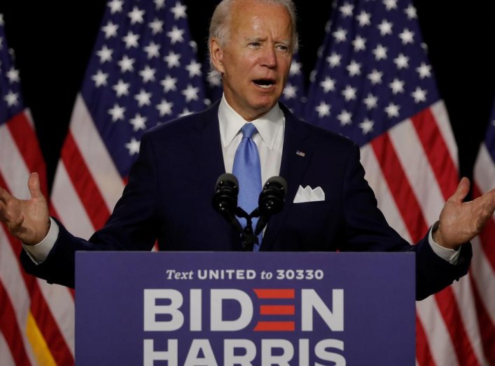 Democratic presidential candidate and former Vice President Joe Biden gestures as he speaks at a campaign event, on his first joint appearance with Vice presidential candidate Senator Kamala Harris after being named his running mate, at Alexis Dupont High