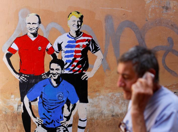 A man walks past a mural signed by "TV Boy" and depicting Russian President Vladimir Putin, U.S. President Donald Trump and Italian Prime Minister Giuseppe Conte as soccer players in downtown Rome, Italy June 15, 2018. REUTERS/Tony Gentile NO RESALES. NO 