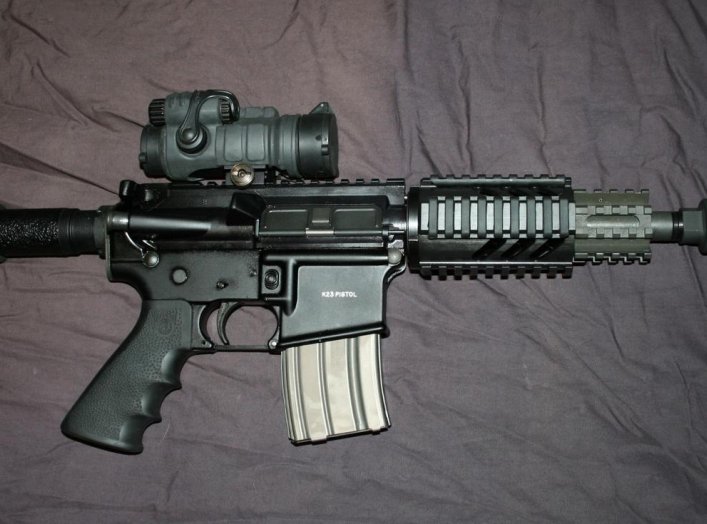 OA K23 Pistol with Aimpoint and Noveske Firing Breathing Pig. Flickr/Stephen Z.