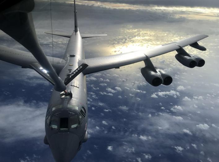 A U.S. Air Force KC-135 Stratotanker, assigned to the 506th Expeditionary Air Refueling Squadron, refuels a B-52 Stratofortress over the Indian Ocean June 10, 2018. (U.S. Air Force photo by Airman 1st Class Gerald R. Willis). Flickr / U.S. Department of D