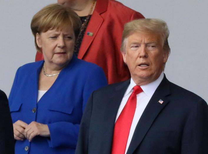 German Chancellor Angela Merkel and U.S. President Donald Trump are seen as they pose for a family photo at the start of the NATO summit in Brussels, Belgium July 11, 2018. REUTERS/Reinhard Krause