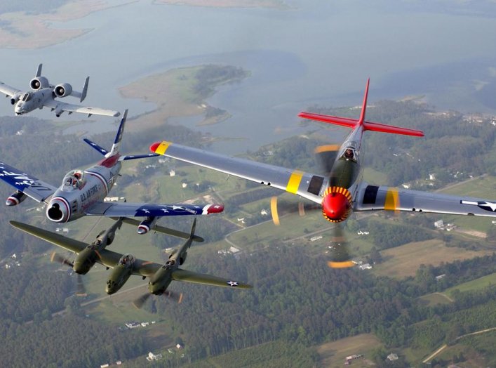 An A-10 Thunderbolt II, F-86 Sabre, P-38 Lightning and P-51 Mustang fly in a heritage flight formation during an air show at Langley Air Force Base, Va., on May 21. U.S. Air Force/Tech. Sgt. Ben Bloker.