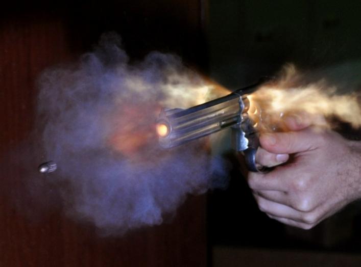 Ultra-high speed photo of bullet fired out of a S&W revolver photographed with an air-gap flash