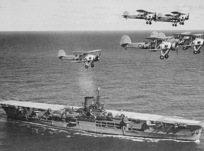  British aircraft carrier Ark Royal with a flight of "Swordfish" overhead, circa 1939. Courtesy of Donald M. McPherson, 1977.