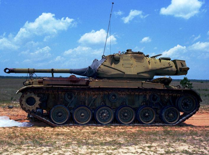 A left side view of a M60 target tank prior to being hit by a Wasp missile during the first tactical weapon system application of millimeter wave seeker technology. The Wasp missile is designed to be launched in groups against massed armor formations.