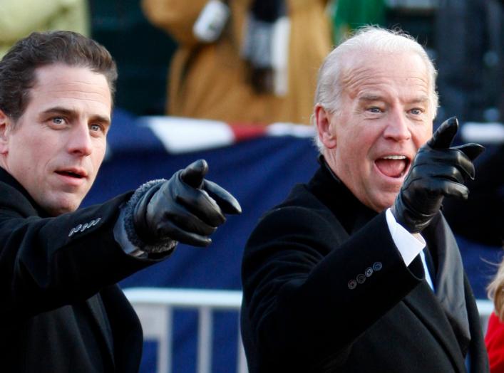 U.S. Vice President Joe Biden (R) points to some faces in the crowd with his son Hunter as they walk down Pennsylvania Avenue following the inauguration ceremony of President Barack Obama in Washington, January 20, 2009. REUTERS/Carlos Barria