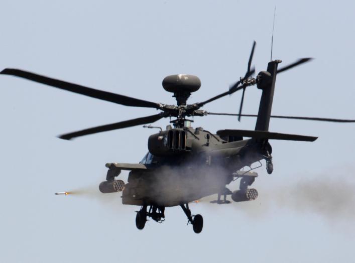 A U.S. AH-64 Apache helicopter fires a missile during a live fire gunnery exercise with the South Korean army at the U.S. army's Rodriguez range in Pocheon