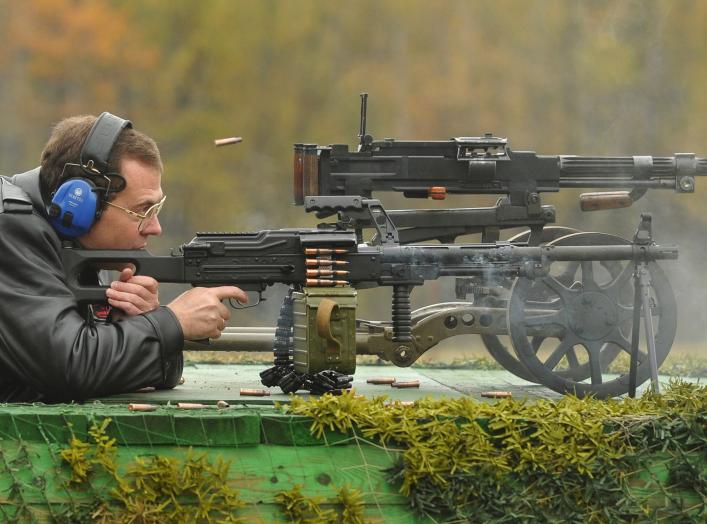 Russia's Prime Minister Dmitry Medvedev takes part in testing small arms at the training ground of the Central Research Institute for Precision Machine Building in Klimovsk, Moscow Region October 3, 2012. REUTERS/Alexander Astafyev/RIA Novosti/Pool (RUSSI