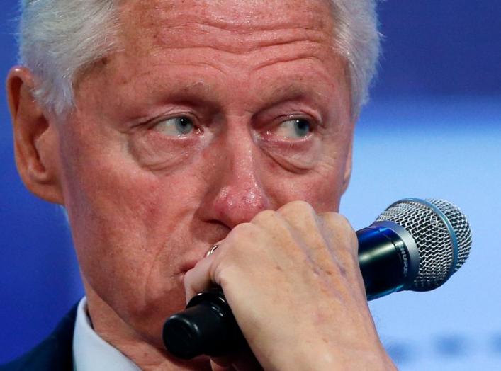 Former U.S. President Bill Clinton listens to speakers during the opening plenary session labeled "Reimagining Impact" at the Clinton Global Initiative 2014 (CGI) in New York, September 22, 2014. The CGI was created by Clinton in 2005 to gather global lea