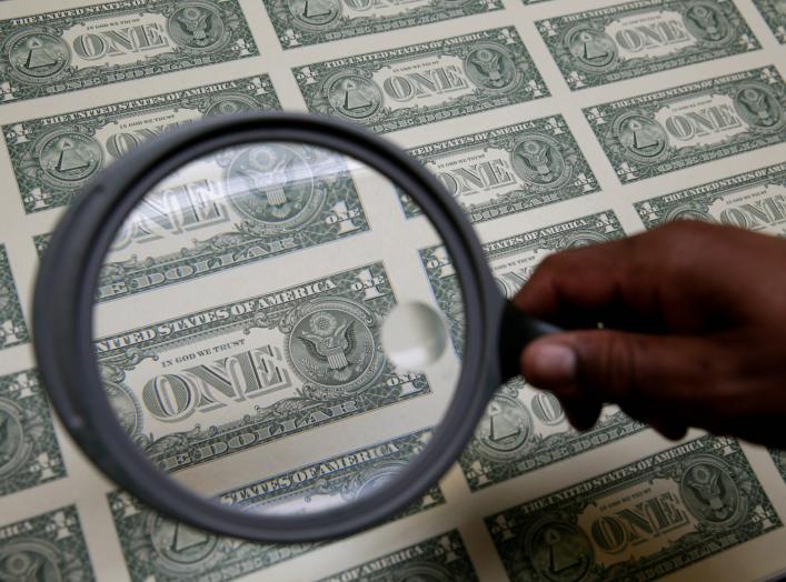 United States one dollar bills are inspected under a magnifying glass during production at the Bureau of Engraving and Printing in Washington November 14, 2014. REUTERS/Gary Cameron 