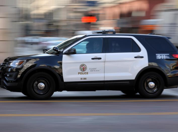 A Los Angeles Police Department cruiser with lights and sirens going speeds down on a city street in Los Angeles, California, U.S. August 10, 2017. REUTERS/Mike Blake