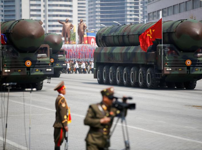 Intercontinental ballistic missiles (ICBM) are driven past the stand with North Korean leader Kim Jong Un and other high ranking officials during a military parade marking the 105th birth anniversary of country's founding father Kim Il Sung, in Pyongyang 