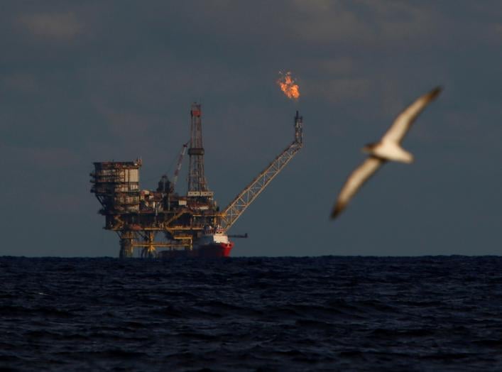 A seagull flies in front of an oil platform in the Bouri Oilfield some 70 nautical miles north of the coast of Libya, October 5, 2017. REUTERS/Darrin Zammit Lupi