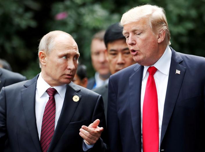 U.S. President Donald Trump and Russia's President Vladimir Putin talk during the family photo session at the APEC Summit in Danang, Vietnam November 11, 2017. REUTERS/Jorge Silva TPX IMAGES OF THE DAY