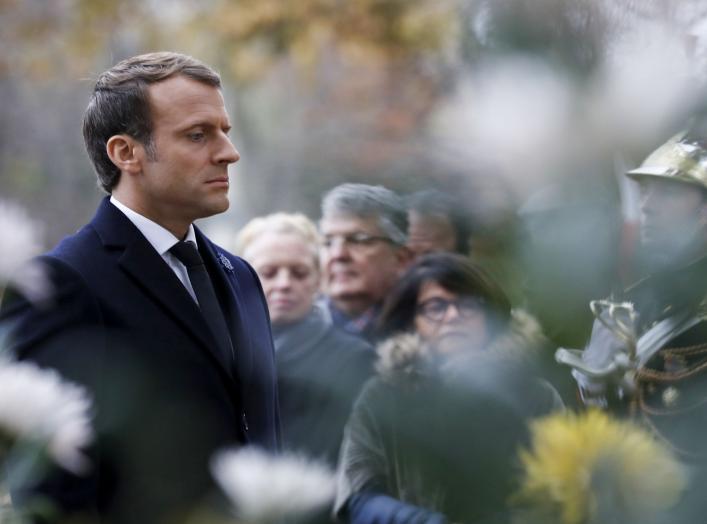 French President Emmanuel Macron stands at attention after laying a wreath in front of the statue of Georges Clemenceau during the Armistice Day commemorations marking the end of World War I in Paris, France, November 11, 2017. REUTERS/Francois Guillot/Po