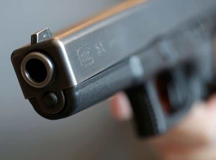 A gun owner displays a Glock 20, 10 mm Auto pistol in Vienna, Austria, March 22, 2018.