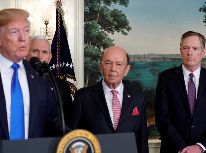 U.S. President Donald Trump, flanked by ?Vice President Mike Pence?, Commerce Secretary Wilbur Ross and U.S. Trade Representative Robert Lighthizer, delivers remarks before signing a memorandum on intellectual property tariffs on high-tech goods from Chin