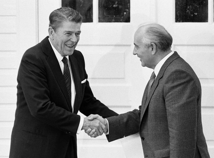 U.S. President Ronald Reagan and Soviet President Mikhail Gorbachev shake hands after their mini-summit meeting in Reykjavik October 12, 1986. REUTERS/Denis Paquin/File Photo