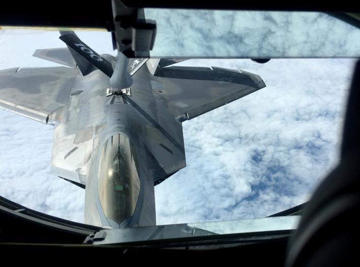 One of two U.S. Air Force F-22 stealth fighter jets receives fuel mid-air from a KC-135 refueling plane over Norway en route to a joint training exercise with Norway's growing fleet of F-35 jets August 15, 2018. REUTERS/Erol Dogrudogan