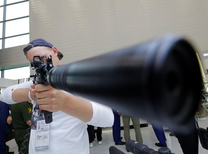 A participant holds a rifle during the annual international military-technical forum "ARMY" at Patriot Expocentre in Moscow Region, Russia August 21, 2018. REUTERS/Maxim Shemetov