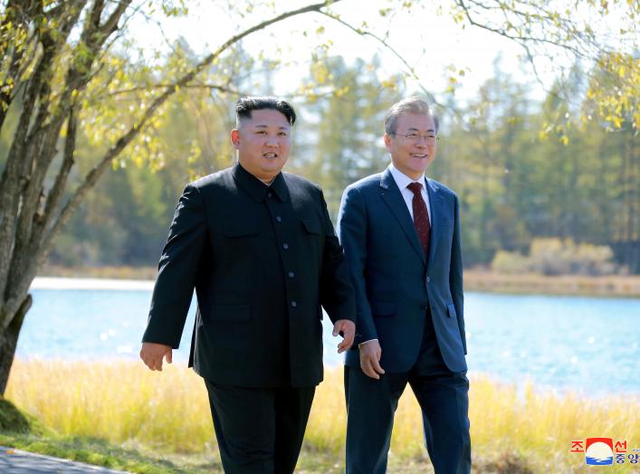 South Korean President Moon Jae-in and North Korean leader Kim Jong Un walk during a luncheon, in this photo released by North Korea's Korean Central News Agency (KCNA) on September 21, 2018. KCNA via REUTERS ATTENTION EDITORS - THIS IMAGE WAS PROVIDED BY