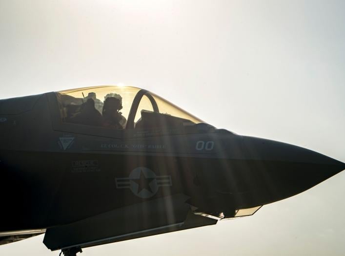 A F-35B Lightning II aircraft from the Marine Fighter Attack Squadron 211 goes through pre-flight checks before launch aboard the amphibious assault ship USS Essex as part of the F-35B's first combat strike, against a Taliban target in Afghanistan, Septem