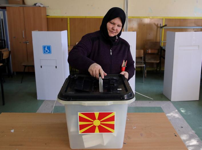 A woman casts her ballot for the referendum in Macedonia on changing the country's name that would open the way for it to join NATO and the European Union in Skopje, Macedonia September 30, 2018. REUTERS/Marko Djurica