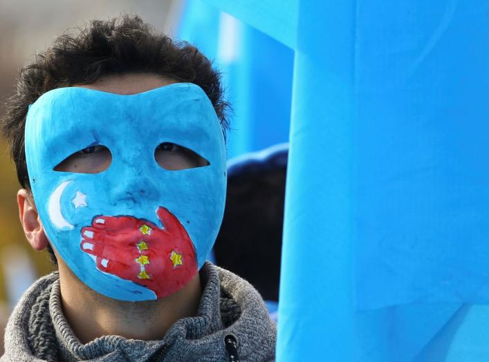 A man takes part in a demonstration against China during its Universal Periodic Review by the Human Rights Council in front of the United Nations Office in Geneva, Switzerland, November 6, 2018. REUTERS/Denis Balibouse