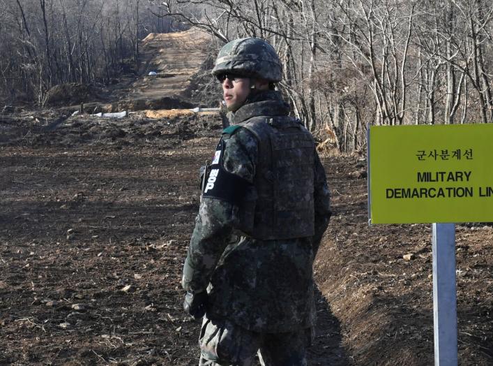 A South Korean soldier stands at the Arrowhead ridge, a site of fierce battles in the 1950-53 Korean War, to build a tactical road across the Military Demarcation Line inside the Demilitarized Zone (DMZ), in the central section of the inter-Korean border 