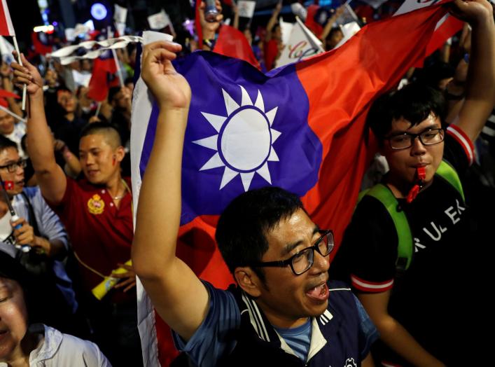 Supporters of Opposition Nationalist Kuomintang Party (KMT) Kaohsiung mayoral candidate Han Kuo-yu celebrate after Han won the local elections, in Kaohsiung, Taiwan November 24, 2018. REUTERS/Tyrone Siu