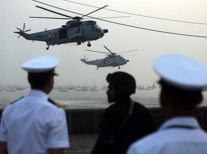 Indian Navy soldiers watch Sea King Mk 42 ASW helicopters during the rehearsal ahead of Navy Day celebrations in Mumbai, India, December 3, 2018. REUTERS/Francis Mascarenhas
