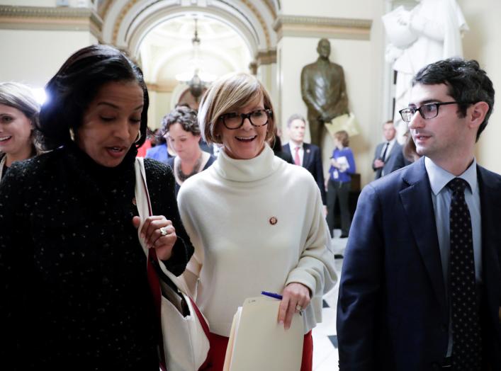 U.S. Reps Susie Lee (D-NV) is followed by Rep. Jahana Hayes (D-CT), Rep. Katie Hill (D-CA) (L) and other freshmen House Democrats as they arrive at Senate Majority Leader Mitch McConnell's (R-KY) office to deliver a letter "urging him to end the shutdown"