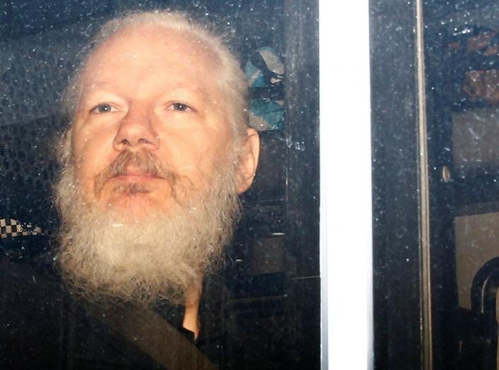 WikiLeaks founder Julian Assange is seen in a police van, after he was arrested by British police, in London, Britain April 11, 2019. REUTERS/Henry Nicholls