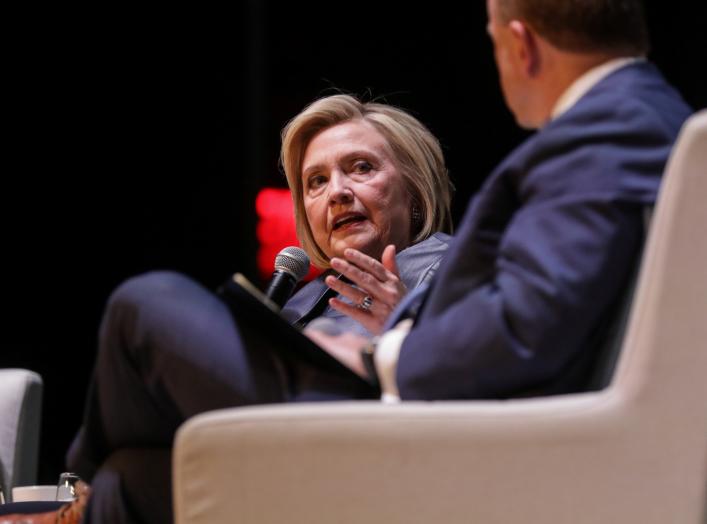 Former Secretary of State Hillary Clinton appears with former President Bill Clinton during a joint on stage conversation event at the Beacon Theatre in New York, U.S., April 11, 2019. REUTERS/Stephen Yang