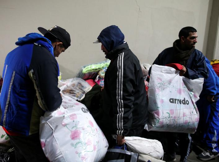 Homeless people receive donations at Argentine soccer team River Plate's stadium in Buenos Aires, Argentina, July 3, 2019. REUTERS/Agustin Marcarian