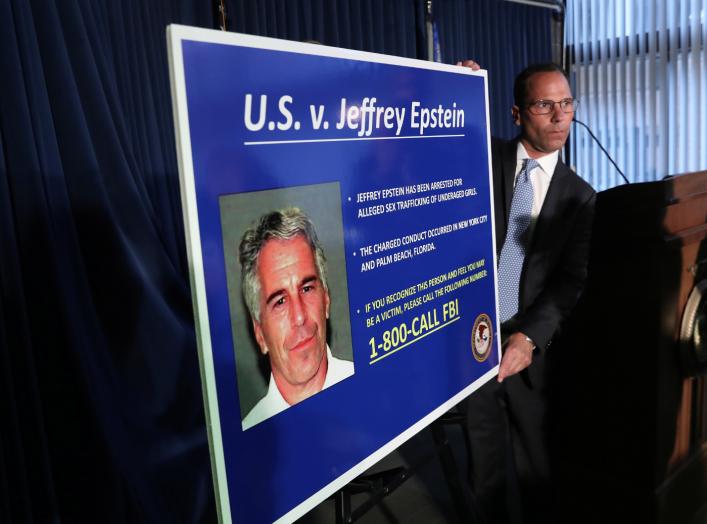 An employee of the Southern District of New York hangs a sign containing a photograph of Jeffrey Epstein, charged of sex trafficking of minors and conspiracy to commit sex trafficking of minors, in New York, U.S., July 8, 2019. REUTERS/Shannon Stapleton