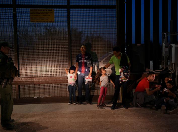 Migrant families from Honduras turn themselves to U.S. Border Patrol to seek asylum following an illegal crossing of the Rio Grande in Hidalgo, Texas, U.S., August 23, 2019. Picture taken August 23, 2019. REUTERS/Loren Elliott 