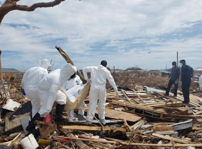 Members of the Bahamian Defense Force remove bodies from the destroyed Abaco shantytown called Pigeon Peas, after Hurricane Dorian in Marsh Harbour, Bahamas September 8, 2019. Picture taken September 8, 2019. REUTERS/Zach Fagenson