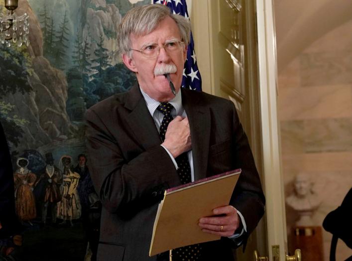 FILE PHOTO: National Security Adviser John Bolton listens to U.S. President Donald Trump's statement on Syria at the White House in Washington, U.S., April 13, 2018. Picture taken April 13, 2018. REUTERS/Yuri Gripas/File Photo